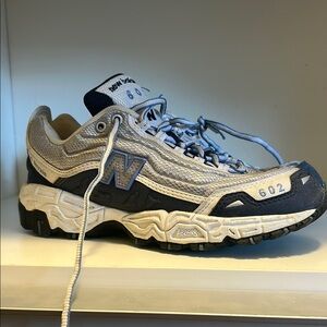 New Balance Blue and White Athletic Shoes with Durable Design